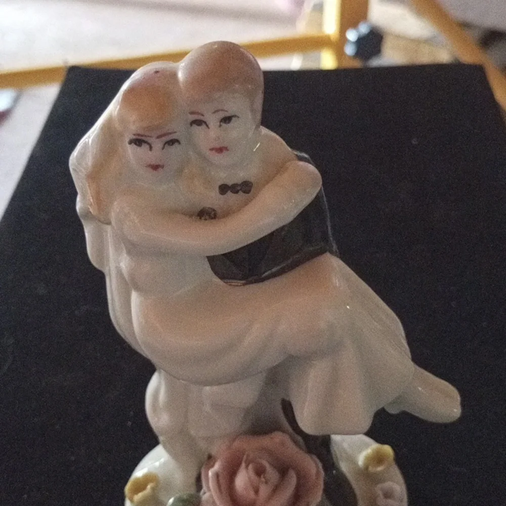 Porcelain Figurine with Floral Base
